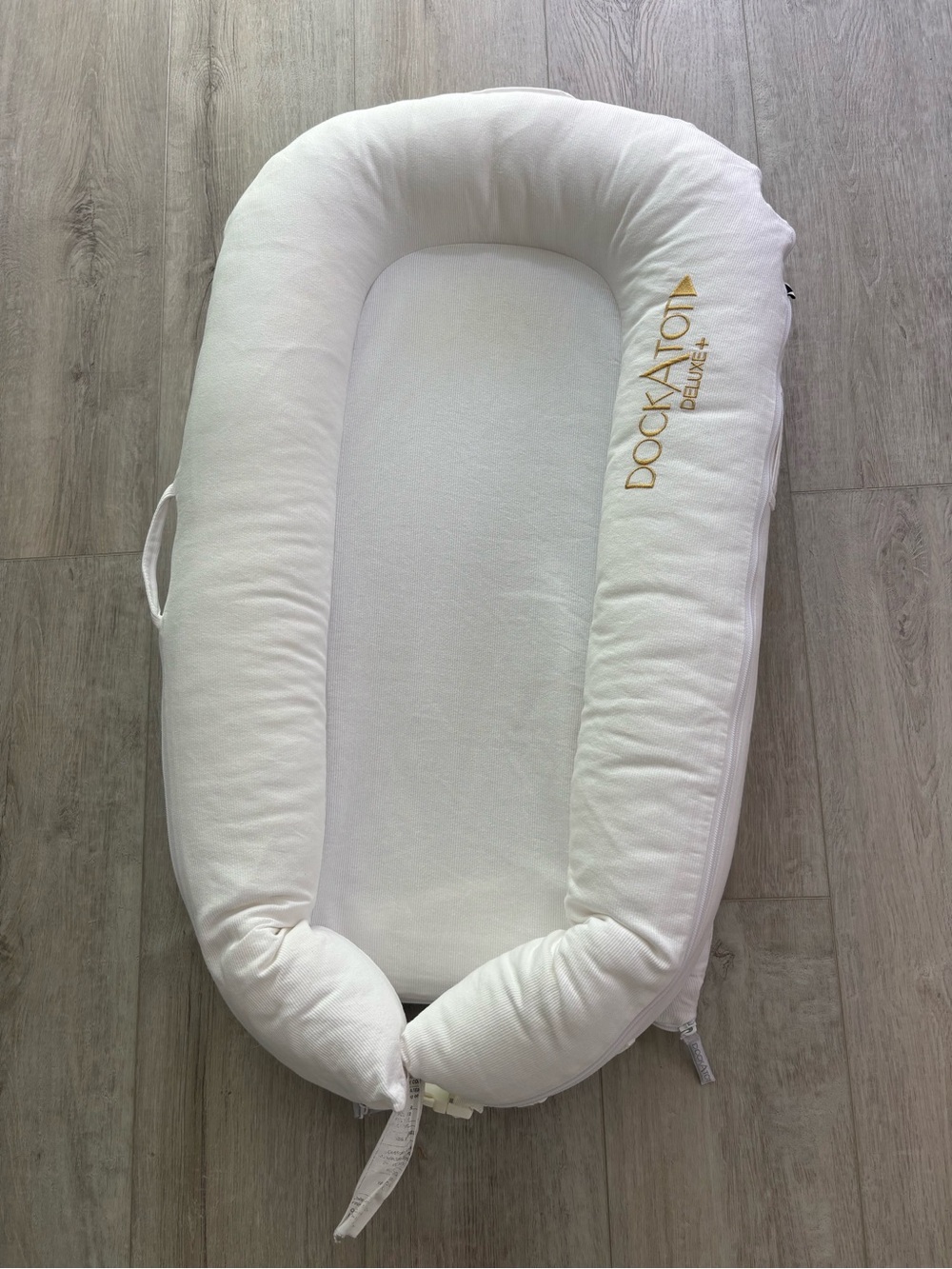 DockATot Deluxe+ Infant Lounger with two covers (white and pineapple)